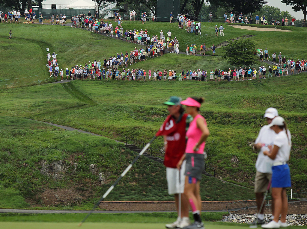 Fans stand on the hill overlooking the 3rd hole across the Conestoga River, during first day action of the 70th US Women's Open at Lancaster Country Club Thursday July 9, 2015. (Photo/Chris Knight)