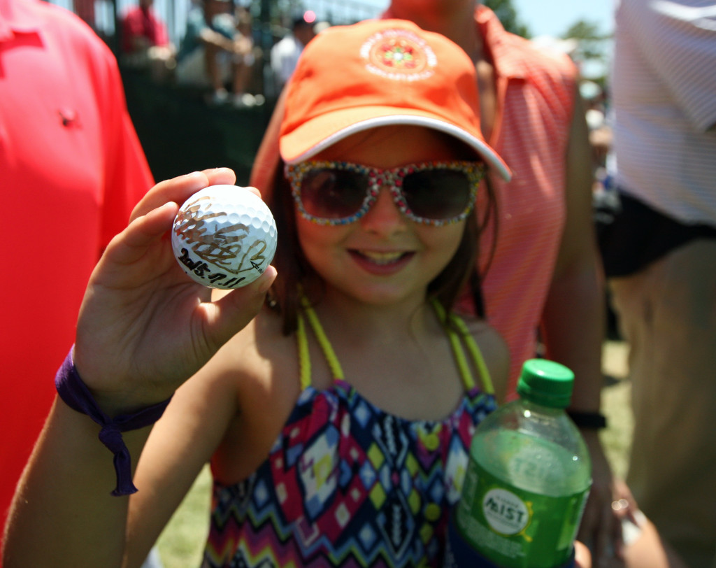 Courtney Lenderman, 8, of Mechanicsburg, shows her autographed ball she received from Shiho Oyama, before she teed oof on the 1st hole, during third day action of the 70th US Women's Open at Lancaster Country Club Saturday July 11, 2015. (Photo/Chris Knight)