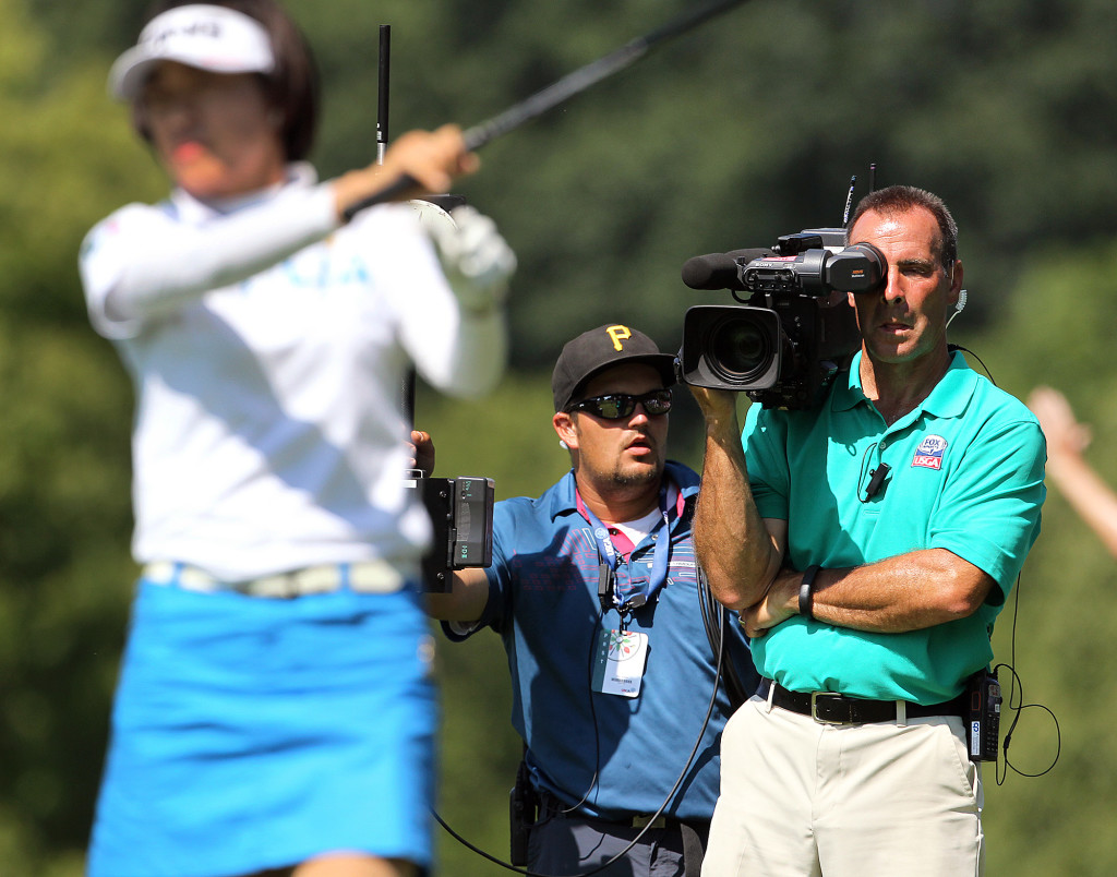 A Fox Sports camera crew gets Shiho Oyama, teeing off on the 9th hole, during third day action of the 70th US Women's Open at Lancaster Country Club Saturday July 11, 2015. (Photo/Chris Knight)