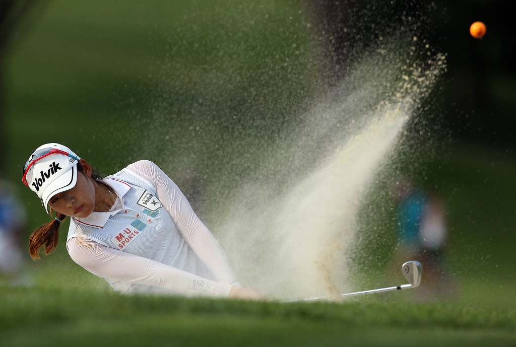 Mi Hyang Lee, blasts out of the bunker on the 18th green, during final day action of the 70th US Women's Open at Lancaster Country Club Sunday July 12, 2015. (Photo/Chris Knight)