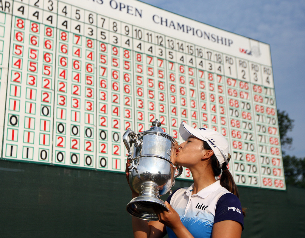 Winner In Gee Chun, kisses the championship trophy, during the trophy presentation of the 70th US Women's Open at Lancaster Country Club Sunday July 12, 2015. (Photo/Chris Knight)