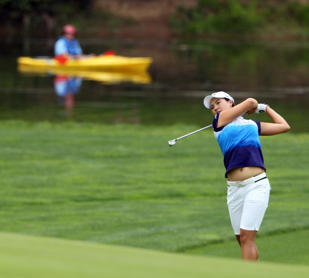 In Gee Chun, hits off the fairway on the 3rd hole, during final day action of the 70th US Women's Open at Lancaster Country Club Sunday July 12, 2015. (Photo/Chris Knight)