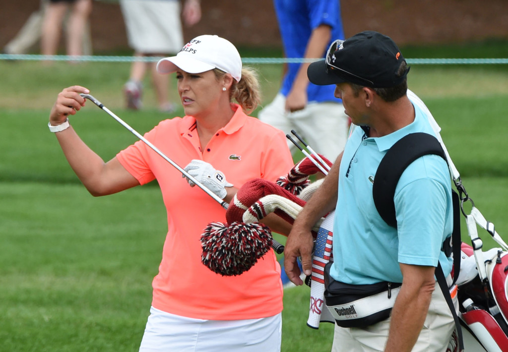 Cristie Kerr pulls a club from her bag carried by her caddie Gregory Johnston during a practice round of the U.S. Women's Open Wednesday. Johnston's brother is the business manager for Penn Manor School District.