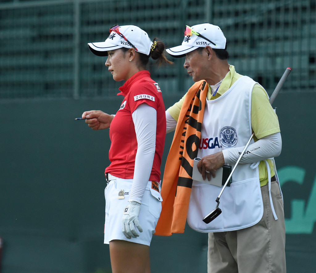 Chella Choi and caddie try to pick a line to land her chip shot from behind the eighth green during the opening round of the US Women's Open at Lancaster Country Club on Thursday, July 9, 2015. (Photo/Suzette Wenger)
