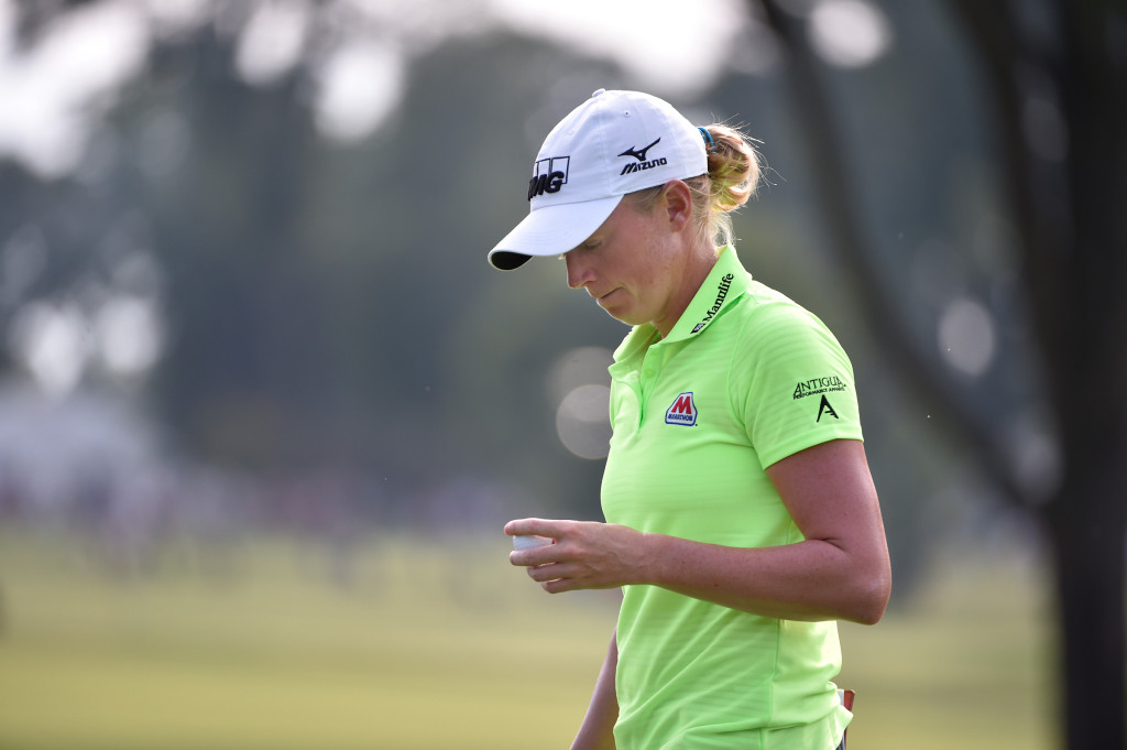 Stacy Lewis looks at her golf ball and realizes her dream is slipping out of her hands after a double bogie on the 15th hole during the final round of the US Women's Open at Lancaster Country Club on Sunday, July 12, 2015. (Photo/Suzette Wenger)