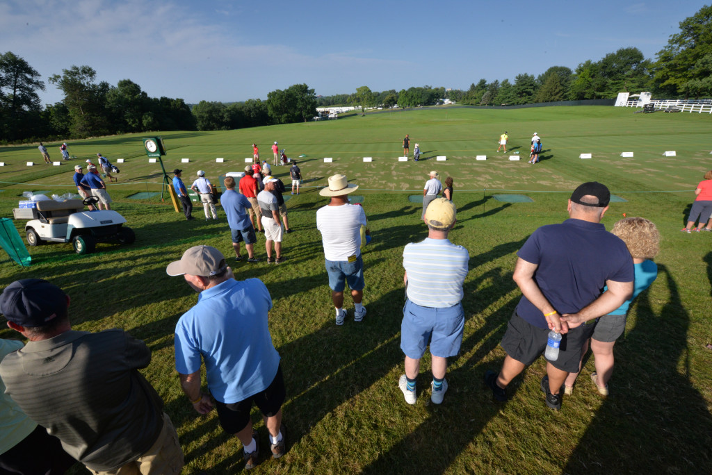 Spectators watch golfers on the driving range at Lancaster Country Club Saturday morning before the start of Round 3 of the 2015 U.S. Women's Open. (Photo/Blaine Shahan)