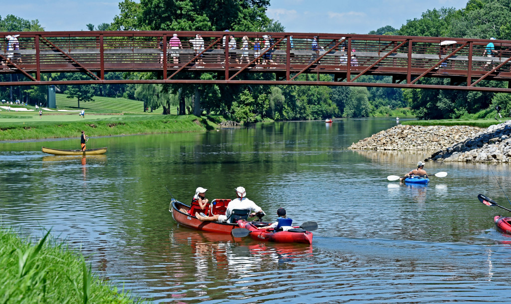 Kayakers and Conoers paddle along the Conestoga River through Lancaster Country Club during the 2013 U.S. Women's Open Saturday. (Photo/Blaine Shahan)