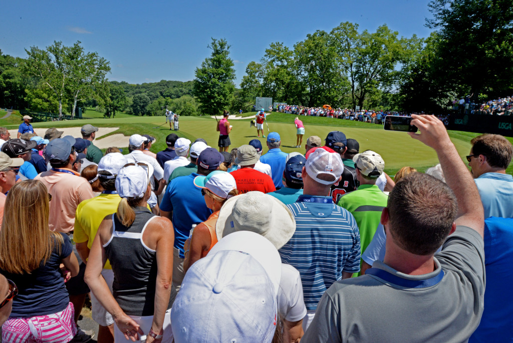Fans Watch Michelle Wie and Pernilla Lindberg putt on #8 at Lancaster Country Club in Round 3 of the 2013 U.S. Women's Open Saturday. (Photo/Blaine Shahan)
