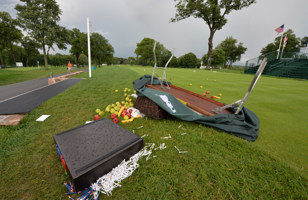 Fruit, golf tees, and pencils were strewn across the tee area on hole number one at Lancaster Country Club Thursday. A table on the tee area that was holding the items was flipped over by winds from a thunderstorm that suspended play at the U.S. Open.  (Photo/Blaine Shahan)