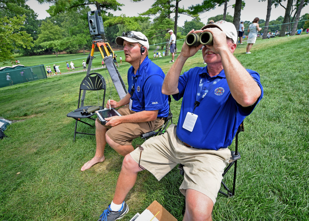Volunteers Jason Lyon, left of Pequea, and Greg Minnich, of Kirkwood, are operating USGA Laser Ball Positioning System on the #3 Fairway at Lancaster Country Club on Round 4 of the U.S. Women's open Sunday. (Photo/Blaine Shahan)