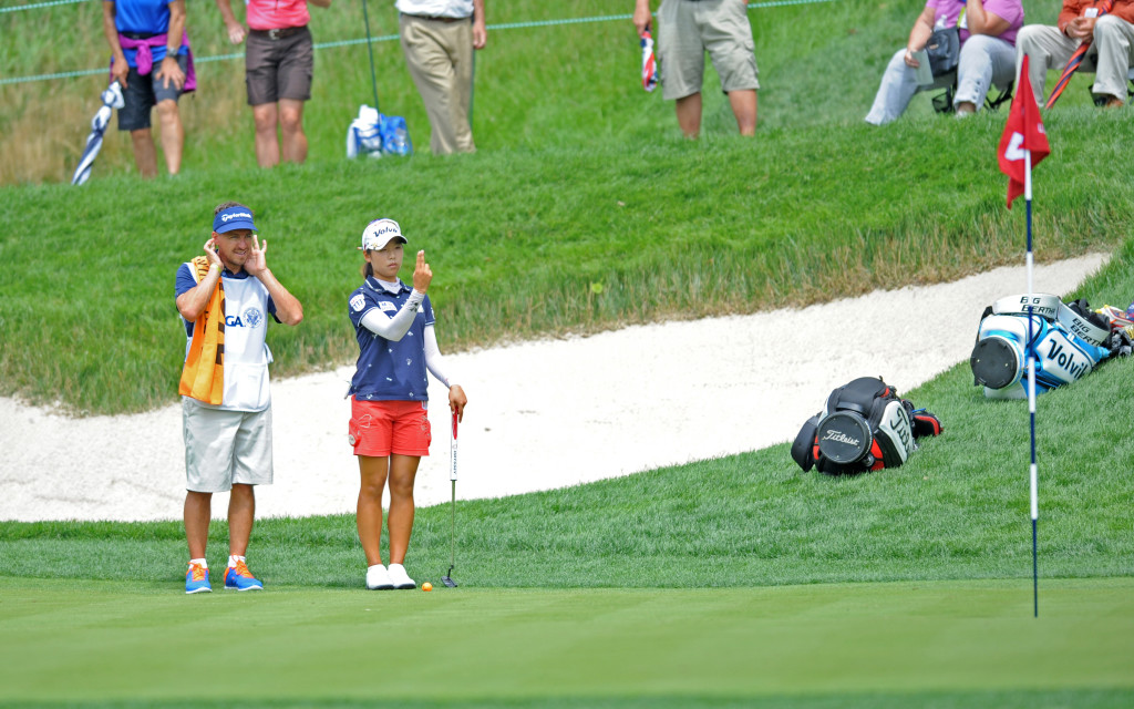 Mi Hyang Lee and her caddie look over the green on seven at Lancaster Country Club in the first round of the 2015 U.S. Open Thursday.  (Photo/Patrick Blain)