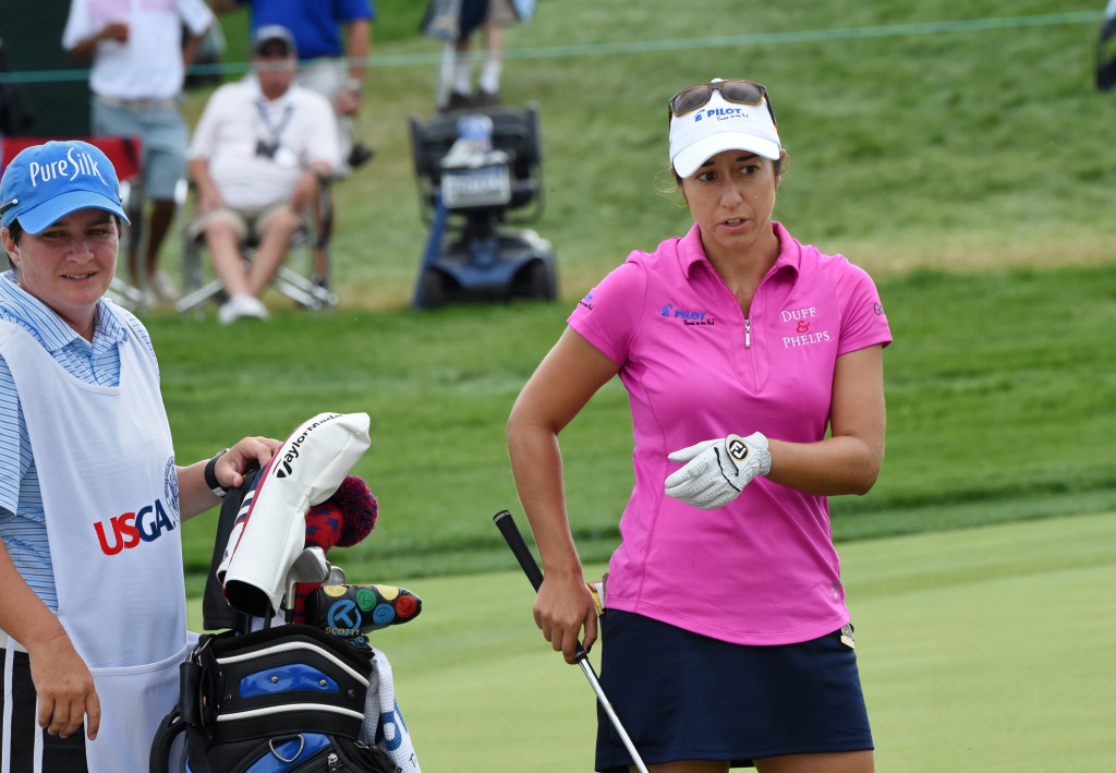 Marina Alex talks to her caddie Meaghan Francella before putting on the 18th green. (Photo/Blaine Shahan)