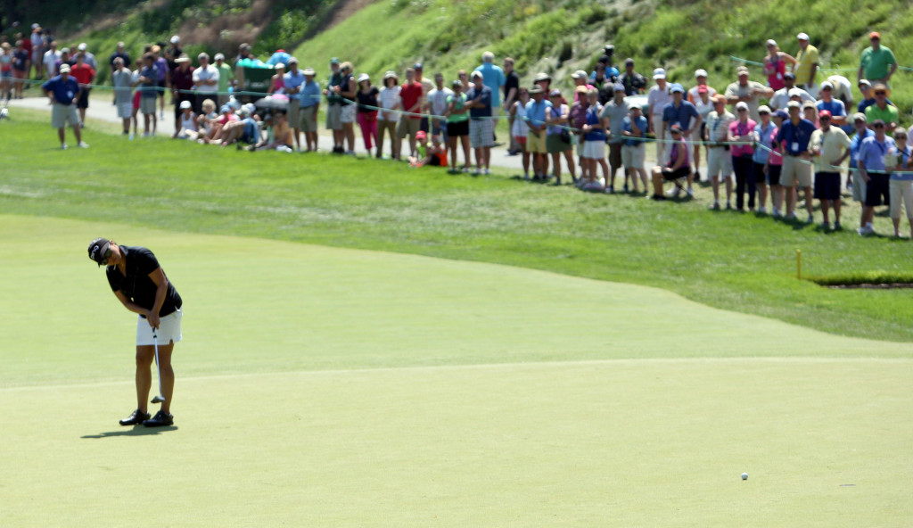 Spectators watch as Jane Park putts on the seventh hole during the third round of play in the U.S. Women's Open at the Lancaster Country Club in Lancaster on Saturday, July 11, 2015. (Photo/Vinny Tennis)