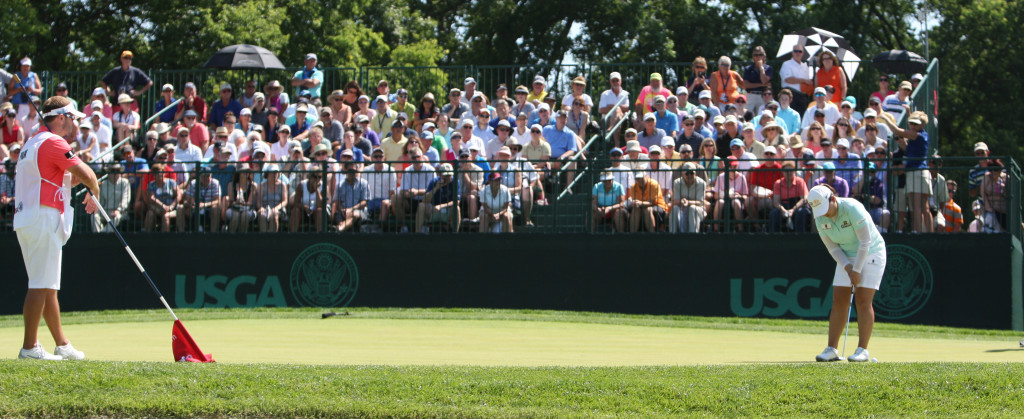 Spectators watch as Inbee Park putts on the eighth hole during the third round of play in the U.S. Women's Open at the Lancaster Country Club in Lancaster on Saturday, July 11, 2015. (Photo/Vinny Tennis)