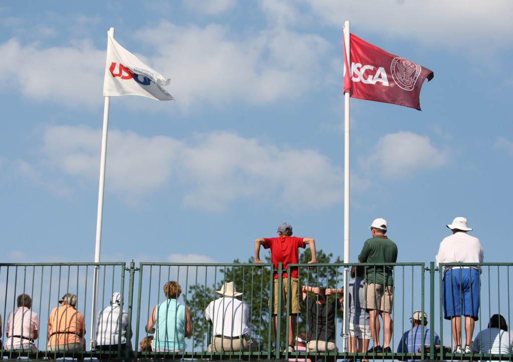 Spectators watch from the grandstands on the 18th hole during the third round of play in the U.S. Women's Open at the Lancaster Country Club in Lancaster on Saturday, July 11, 2015. (Photo/Vinny Tennis)