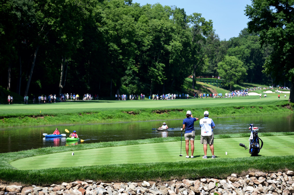 Marina Alex waits for a group of kayakers in the Conestoga River before teeing off on the seventh hole during Round 2 of the US Women's Open at Lancaster Country Club on Friday, July 10. (Casey Kreider/LNP)