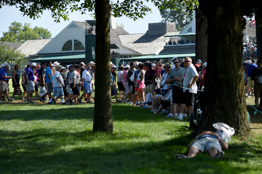 A man takes a nap in the shade of a tree along the 18th fairway during Round 2 of the US Women's Open at Lancaster Country Club on Friday, July 10. (Casey Kreider/LNP)
